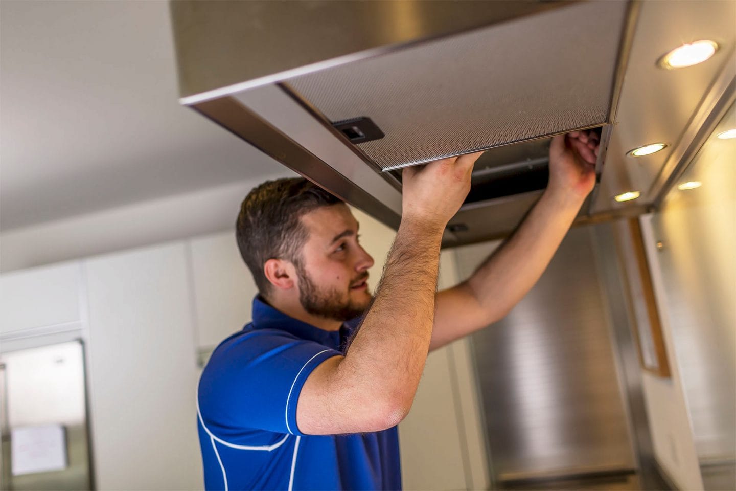 Kitchen hood installer fitting commercial canopy in Belfast